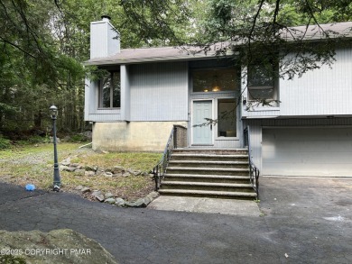 Located among a golf course, fishing spots and pools, tennis on Pocono Farms Country Club in Pennsylvania - for sale on GolfHomes.com, golf home, golf lot