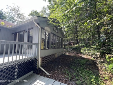 Located among a golf course, fishing spots and pools, tennis on Pocono Farms Country Club in Pennsylvania - for sale on GolfHomes.com, golf home, golf lot