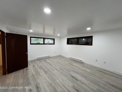 Located among a golf course, fishing spots and pools, tennis on Pocono Farms Country Club in Pennsylvania - for sale on GolfHomes.com, golf home, golf lot