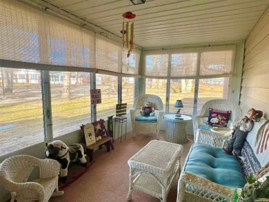 Superb location! You look out the sunroom windows right at the on Leisure Village Golf Course in New York - for sale on GolfHomes.com, golf home, golf lot
