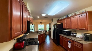 RARE WAKEFIELD MODEL! Located in the upscale 55+ community On on On Top of the World Golf Course in Florida - for sale on GolfHomes.com, golf home, golf lot