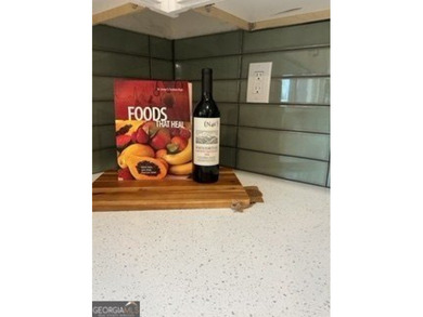 Welcome home! This beautifully remodeled 3-bedroom, 2 bath home on East Lake Golf Club in Georgia - for sale on GolfHomes.com, golf home, golf lot