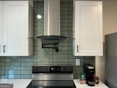 Welcome home! This beautifully remodeled 3-bedroom, 2 bath home on East Lake Golf Club in Georgia - for sale on GolfHomes.com, golf home, golf lot