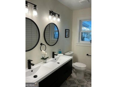 Welcome home! This beautifully remodeled 3-bedroom, 2 bath home on East Lake Golf Club in Georgia - for sale on GolfHomes.com, golf home, golf lot