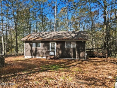 Dreaming of a Pocono escape without the hefty price tag? This on The Hideout Golf in Pennsylvania - for sale on GolfHomes.com, golf home, golf lot