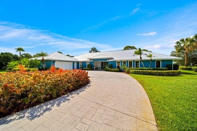 This 4BR/3BA CBS pool home sits on a private 1-acre cul-de-sac on Evergreen Club in Florida - for sale on GolfHomes.com, golf home, golf lot