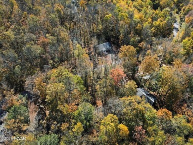 Dreaming of a Pocono escape without the hefty price tag? This on The Hideout Golf in Pennsylvania - for sale on GolfHomes.com, golf home, golf lot