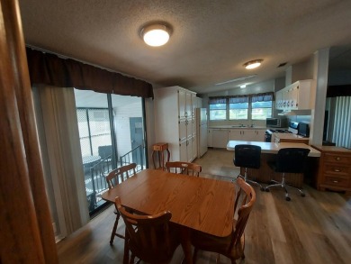 Air conditioned lanai & screened in porch are 2 ways to enjoy on Lakes at Leesburg Golf Course in Florida - for sale on GolfHomes.com, golf home, golf lot