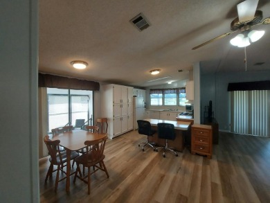 Air conditioned lanai & screened in porch are 2 ways to enjoy on Lakes at Leesburg Golf Course in Florida - for sale on GolfHomes.com, golf home, golf lot