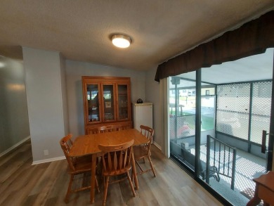Air conditioned lanai & screened in porch are 2 ways to enjoy on Lakes at Leesburg Golf Course in Florida - for sale on GolfHomes.com, golf home, golf lot