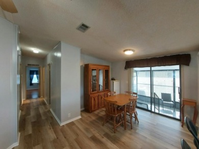 Air conditioned lanai & screened in porch are 2 ways to enjoy on Lakes at Leesburg Golf Course in Florida - for sale on GolfHomes.com, golf home, golf lot