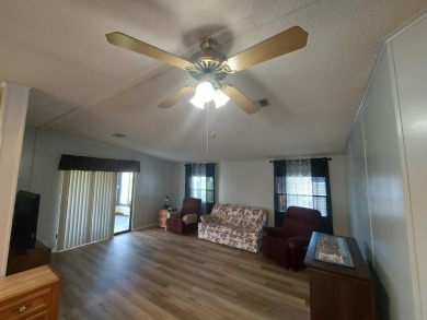 Air conditioned lanai & screened in porch are 2 ways to enjoy on Lakes at Leesburg Golf Course in Florida - for sale on GolfHomes.com, golf home, golf lot