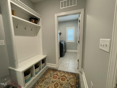 This lovely 5 bedroom, 3 full baths with a first floor primary on Olde Liberty Golf and Country Club in North Carolina - for sale on GolfHomes.com, golf home, golf lot