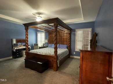 This lovely 5 bedroom, 3 full baths with a first floor primary on Olde Liberty Golf and Country Club in North Carolina - for sale on GolfHomes.com, golf home, golf lot