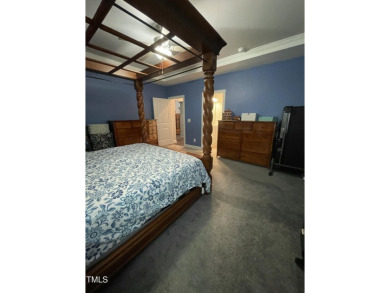 This lovely 5 bedroom, 3 full baths with a first floor primary on Olde Liberty Golf and Country Club in North Carolina - for sale on GolfHomes.com, golf home, golf lot