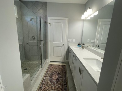 This lovely 5 bedroom, 3 full baths with a first floor primary on Olde Liberty Golf and Country Club in North Carolina - for sale on GolfHomes.com, golf home, golf lot