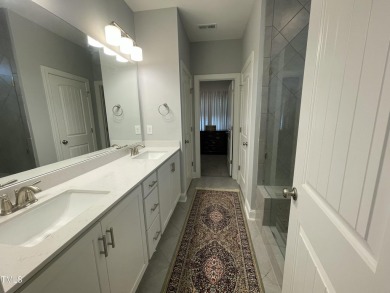 This lovely 5 bedroom, 3 full baths with a first floor primary on Olde Liberty Golf and Country Club in North Carolina - for sale on GolfHomes.com, golf home, golf lot