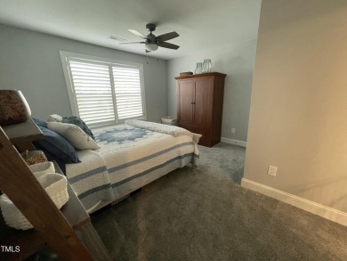 This lovely 5 bedroom, 3 full baths with a first floor primary on Olde Liberty Golf and Country Club in North Carolina - for sale on GolfHomes.com, golf home, golf lot