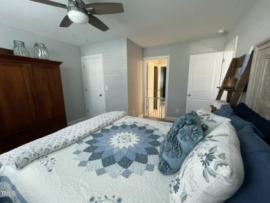 This lovely 5 bedroom, 3 full baths with a first floor primary on Olde Liberty Golf and Country Club in North Carolina - for sale on GolfHomes.com, golf home, golf lot