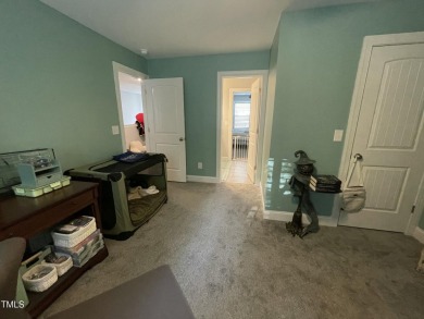 This lovely 5 bedroom, 3 full baths with a first floor primary on Olde Liberty Golf and Country Club in North Carolina - for sale on GolfHomes.com, golf home, golf lot
