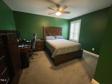This lovely 5 bedroom, 3 full baths with a first floor primary on Olde Liberty Golf and Country Club in North Carolina - for sale on GolfHomes.com, golf home, golf lot