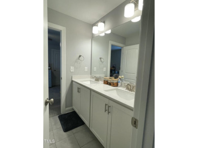This lovely 5 bedroom, 3 full baths with a first floor primary on Olde Liberty Golf and Country Club in North Carolina - for sale on GolfHomes.com, golf home, golf lot