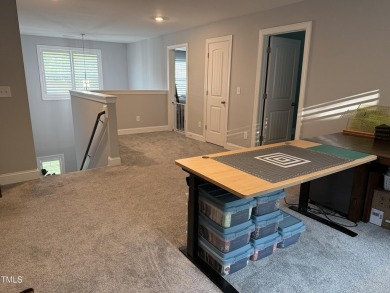 This lovely 5 bedroom, 3 full baths with a first floor primary on Olde Liberty Golf and Country Club in North Carolina - for sale on GolfHomes.com, golf home, golf lot