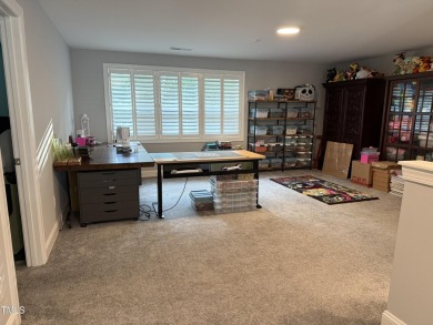 This lovely 5 bedroom, 3 full baths with a first floor primary on Olde Liberty Golf and Country Club in North Carolina - for sale on GolfHomes.com, golf home, golf lot