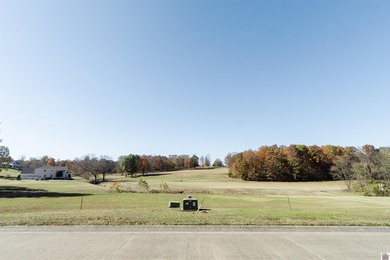 With the backyard facing Benton Golf & Country Club's hole 17 on  in Kentucky - for sale on GolfHomes.com, golf home, golf lot