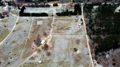 Nestled atop a scenic hill this property offers five acres along on Benona Shores Golf Course in Michigan - for sale on GolfHomes.com, golf home, golf lot