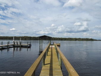 THIS IS IT!  The lot with DOCK, BULKHEAD, DRIVEWAY, WATER & on Live Oak Golf and Country Club in Florida - for sale on GolfHomes.com, golf home, golf lot