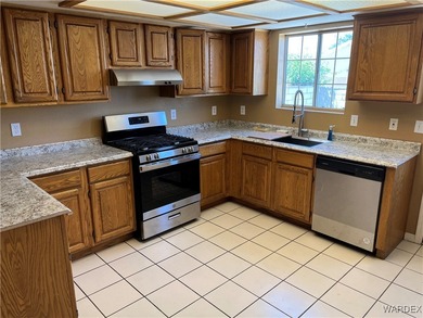 Welcome home to comfort, style, and a fantastic central Kingman on Cerbat Cliffs Golf Course in Arizona - for sale on GolfHomes.com, golf home, golf lot