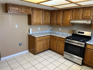 Welcome home to comfort, style, and a fantastic central Kingman on Cerbat Cliffs Golf Course in Arizona - for sale on GolfHomes.com, golf home, golf lot