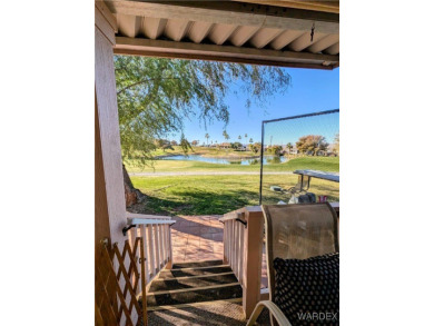 Gorgeous Golf Course Home. View of the pond and the lush green on Riverview Golf Course in Arizona - for sale on GolfHomes.com, golf home, golf lot