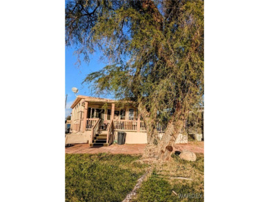 Gorgeous Golf Course Home. View of the pond and the lush green on Riverview Golf Course in Arizona - for sale on GolfHomes.com, golf home, golf lot