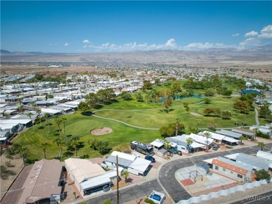 Gorgeous Golf Course Home. View of the pond and the lush green on Riverview Golf Course in Arizona - for sale on GolfHomes.com, golf home, golf lot