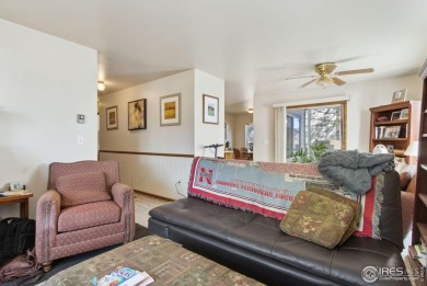 Enjoy easy main-floor living in this 2-bedroom, 1-bath end-unit on Collindale Golf Course in Colorado - for sale on GolfHomes.com, golf home, golf lot