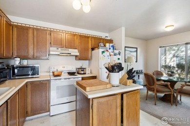 Enjoy easy main-floor living in this 2-bedroom, 1-bath end-unit on Collindale Golf Course in Colorado - for sale on GolfHomes.com, golf home, golf lot