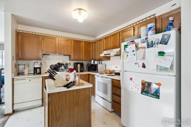 Enjoy easy main-floor living in this 2-bedroom, 1-bath end-unit on Collindale Golf Course in Colorado - for sale on GolfHomes.com, golf home, golf lot