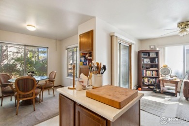 Enjoy easy main-floor living in this 2-bedroom, 1-bath end-unit on Collindale Golf Course in Colorado - for sale on GolfHomes.com, golf home, golf lot
