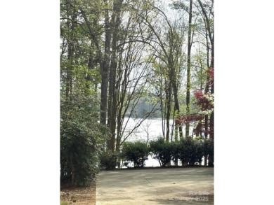 Discover the perfect setting for your forever home on this on Old North State Club at Uwharrie Point Golf community in North Carolina - for sale on GolfHomes.com, golf home, golf lot