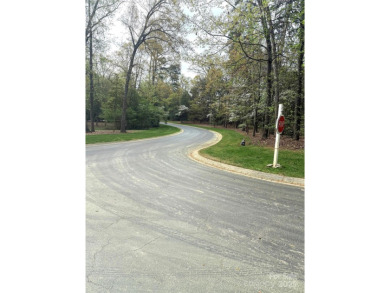 Discover the perfect setting for your forever home on this on Old North State Club at Uwharrie Point Golf community in North Carolina - for sale on GolfHomes.com, golf home, golf lot