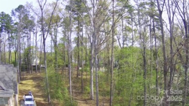 Discover the perfect setting for your forever home on this on Old North State Club at Uwharrie Point Golf community in North Carolina - for sale on GolfHomes.com, golf home, golf lot