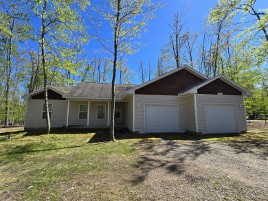 Your Forever Home or Perfect Up-North Oasis! Discover comfort on Michaywe Pines Course in Michigan - for sale on GolfHomes.com, golf home, golf lot