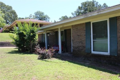 Welcome home to 1314 E Todd Street, in a prime location right on Pine Hills Country Club in Louisiana - for sale on GolfHomes.com, golf home, golf lot