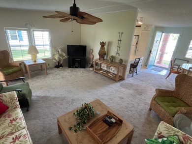 Welcome to this charming two-bedroom, two-bath home located in on Pine Lakes Country Club in Florida - for sale on GolfHomes.com, golf home, golf lot