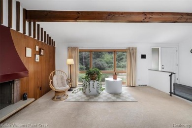 Step into this one-of-a-kind mid-century modern home tucked away on Kensington Metropark Golf Course in Michigan - for sale on GolfHomes.com, golf home, golf lot
