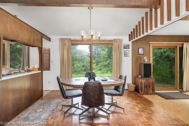 Step into this one-of-a-kind mid-century modern home tucked away on Kensington Metropark Golf Course in Michigan - for sale on GolfHomes.com, golf home, golf lot