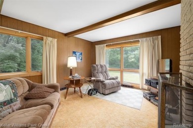 Step into this one-of-a-kind mid-century modern home tucked away on Kensington Metropark Golf Course in Michigan - for sale on GolfHomes.com, golf home, golf lot