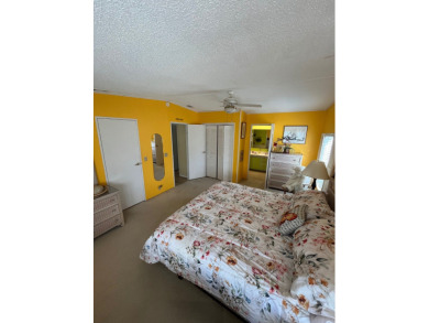 Welcome to this charming two-bedroom, two-bath home located in on Pine Lakes Country Club in Florida - for sale on GolfHomes.com, golf home, golf lot